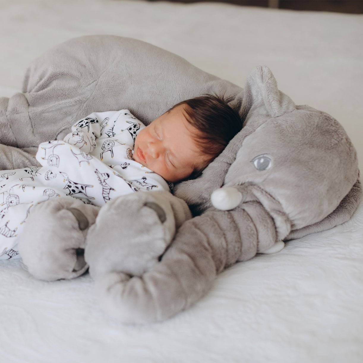 Plush elephant pillow for kids, perfect for cuddling and playtime, featuring super-soft comfort cushion, available in two sizes. 1