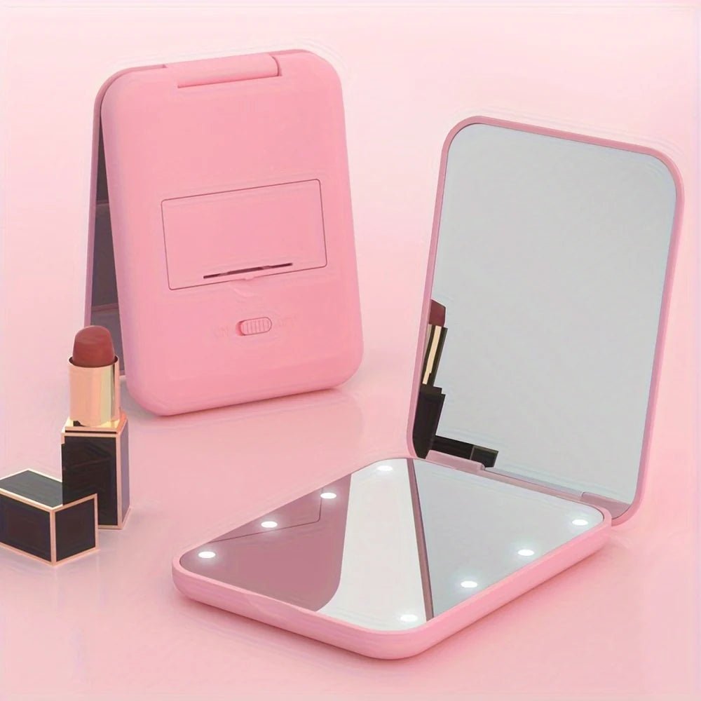 Pocket makeup mirror with LED light and dual magnification, featuring a compact design in stylish pink and green colors, perfect for on-the-go touch-ups and 0
