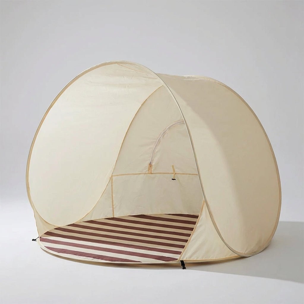Pop Up Beach Tent with instant setup for 3-4 people, providing sun protection and a portable shelter for outdoor activities at the beach. 0