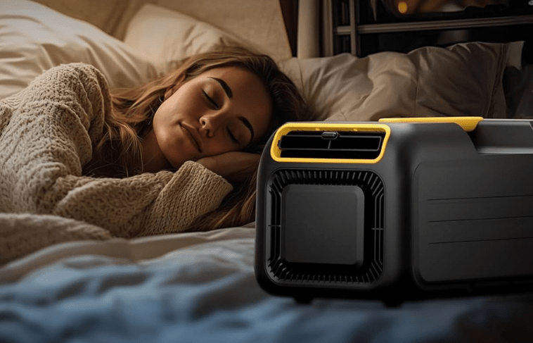 Portable air conditioner with ergonomic handle, designed for compact cooling during camping and outdoor adventures, featuring a sleek and lightweight design for easy transport. 2