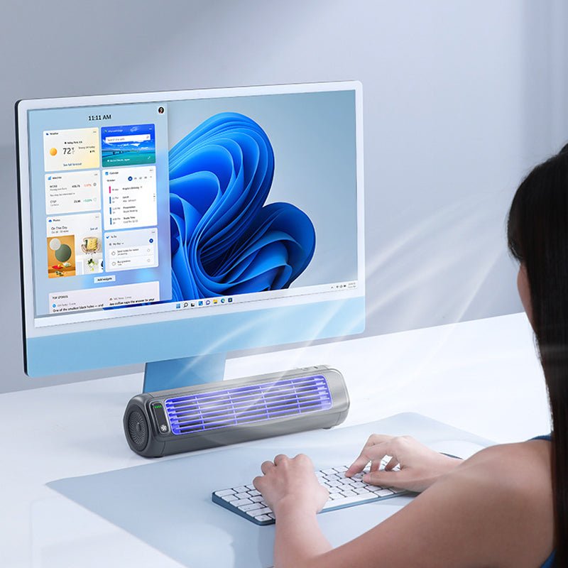 Portable air cooler with a rechargeable battery in a compact bladeless design, featuring a sleek grey finish and capable of providing up to 12 hours of cooling 7
