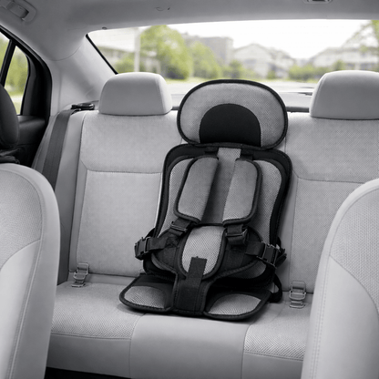 Portable booster seat for children featuring cushioned support, designed for safety and comfort during travel, lightweight for easy installation. 9