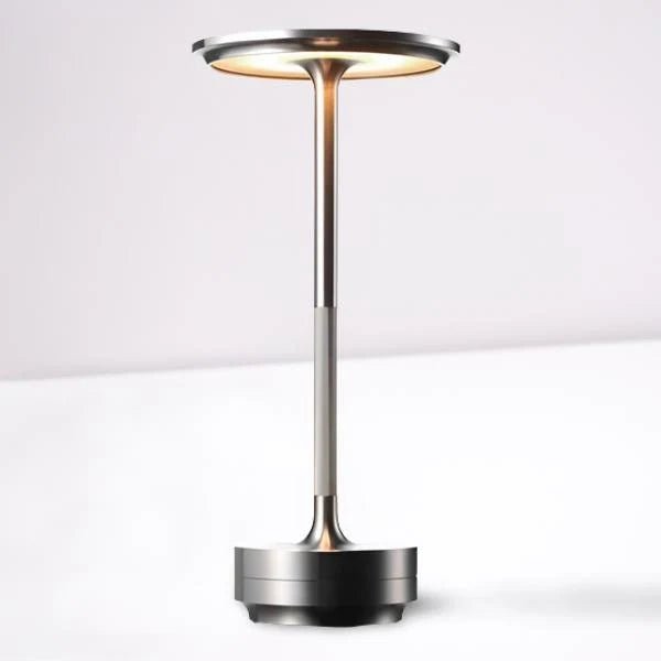 Portable cordless table lamp with adjustable brightness, featuring a sleek metallic finish, ideal for both indoor and outdoor use. 5