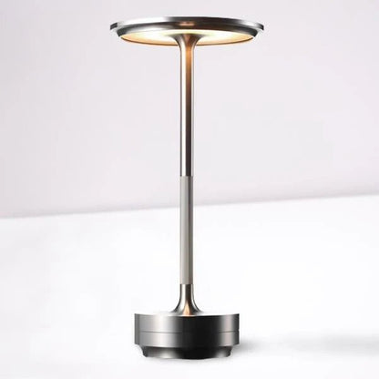Portable cordless table lamp with adjustable brightness, featuring a sleek metallic finish, ideal for both indoor and outdoor use. 5
