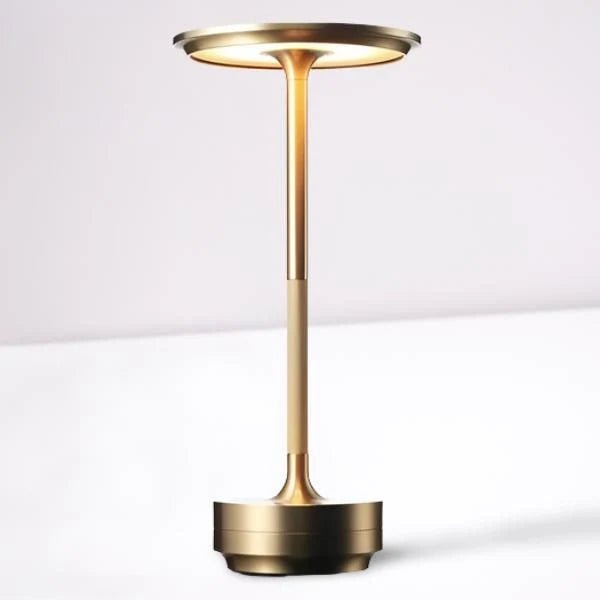 Portable cordless table lamp with adjustable brightness, featuring a sleek metallic finish, ideal for both indoor and outdoor use. 6
