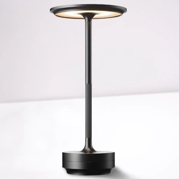 Portable cordless table lamp with adjustable brightness, featuring a sleek metallic finish, ideal for both indoor and outdoor use. 7