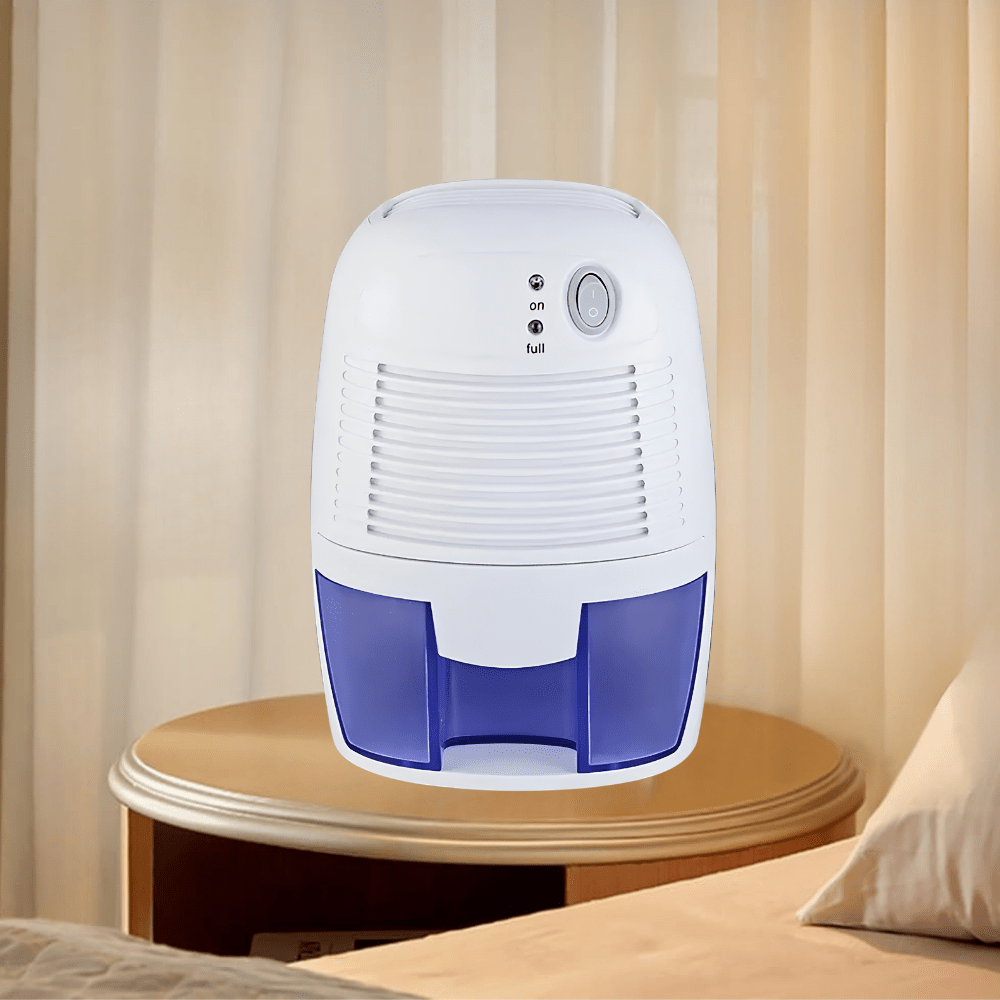 Portable dehumidifier for bedroom in white, designed for quiet operation; compact moisture absorber perfect for small spaces. 0