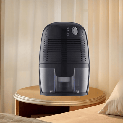 Portable dehumidifier for bedroom in white, designed for quiet operation; compact moisture absorber perfect for small spaces. 3