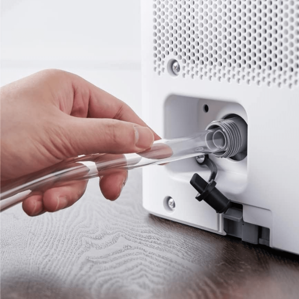 Portable dehumidifier for home moisture control featuring a large tank and smart features, designed for compact use in bedrooms or bathrooms. 5