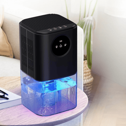 Portable dehumidifier designed for small spaces, featuring a timer and soothing night light, perfect for quiet operation in bedrooms and bathrooms. 0