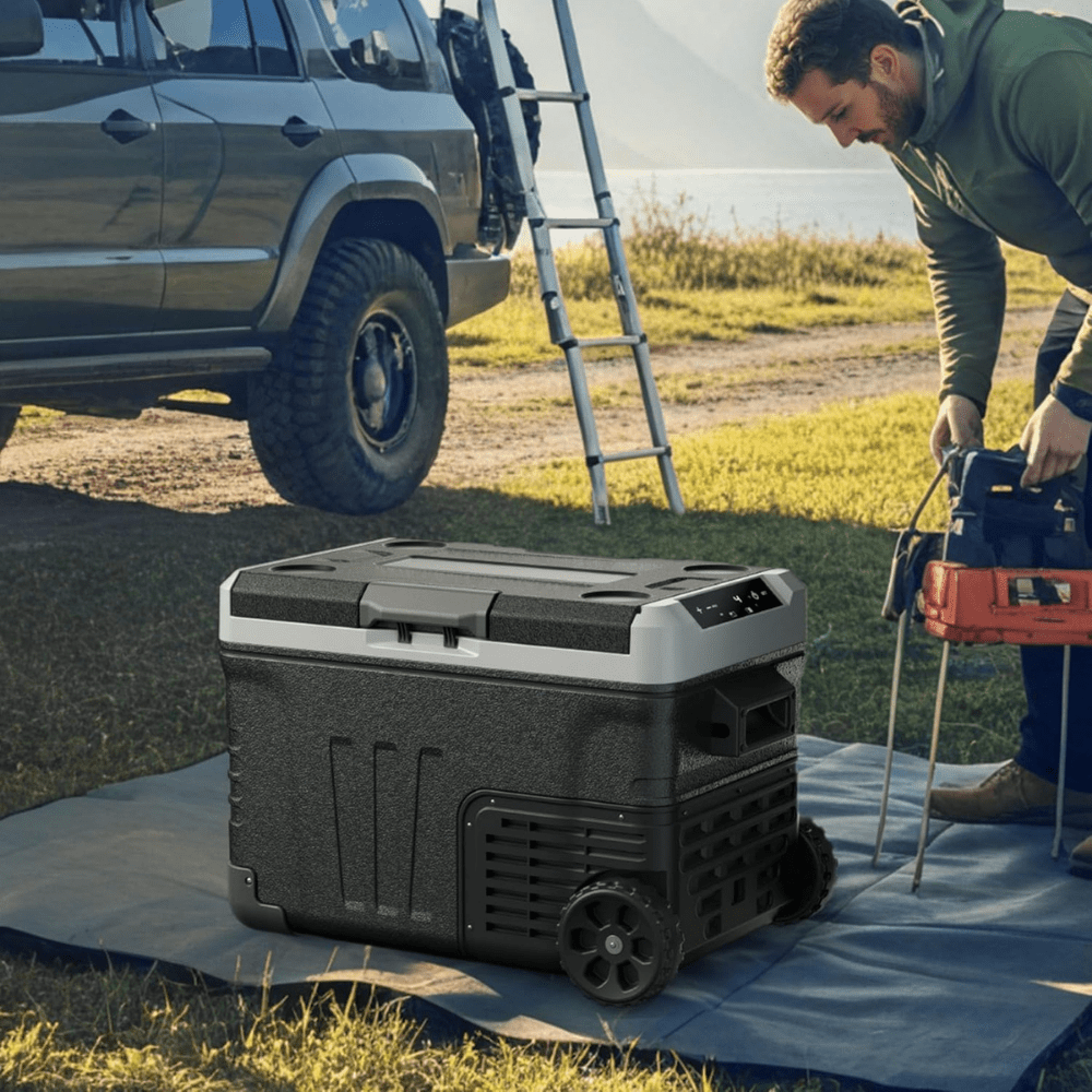 Portable fridge freezer featuring dual zone cooling, 53QT capacity, and rolling wheels, perfect for camping and travel, designed for 12V car use 1