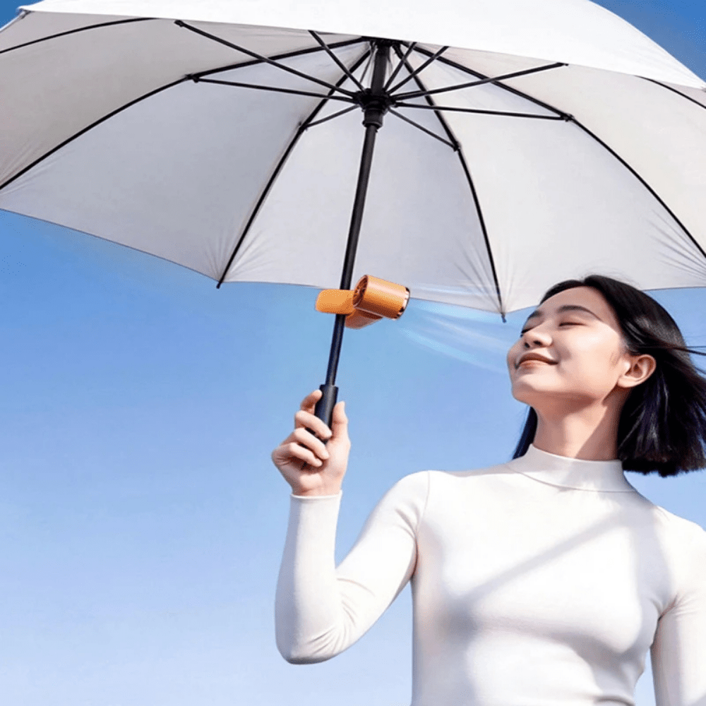 Portable handheld fan featuring a clip-on design, perfect for on-the-go use, with a USB rechargeable battery for convenience and portability. 3
