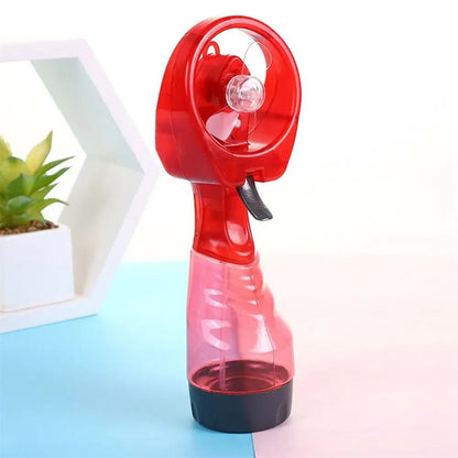 Portable handheld misting fan with rechargeable battery, perfect for travel and outdoor use, featuring a sleek design and cooling spray functionality. 1