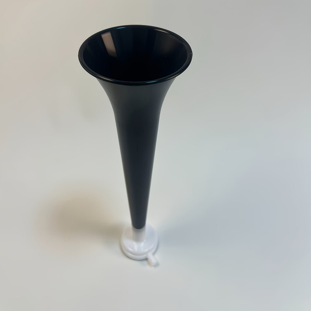 Portable high decibel air horn in lightweight PVC design, perfect for events and safety use, showcased in a vibrant outdoor setting. 1