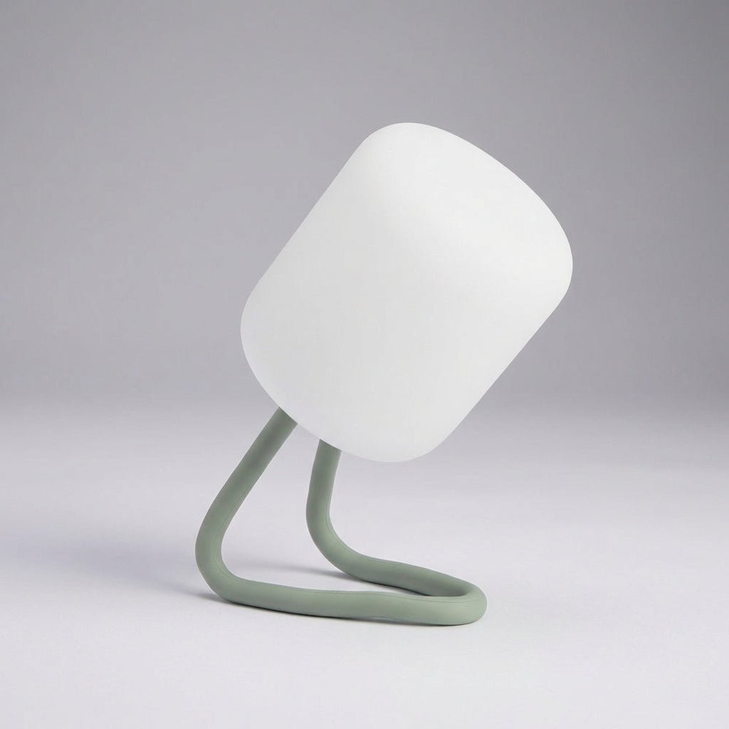 Portable LED night light featuring a soft ambient glow, available in green and blue, designed for battery-powered convenience and compact use. 0