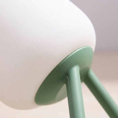 Portable LED night light featuring a soft ambient glow, available in green and blue, designed for battery-powered convenience and compact use. 3