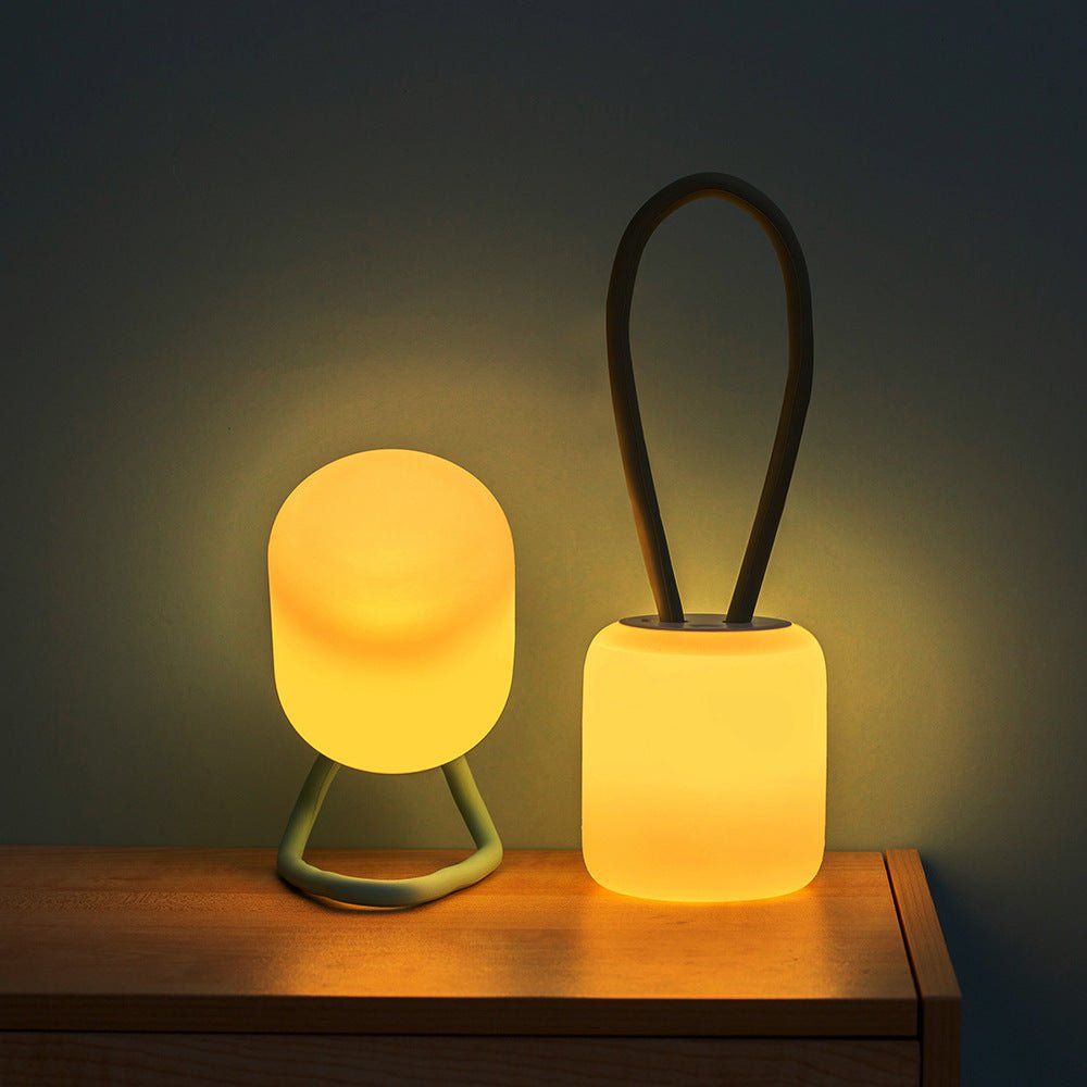 Portable LED night light featuring a soft ambient glow, available in green and blue, designed for battery-powered convenience and compact use. 4