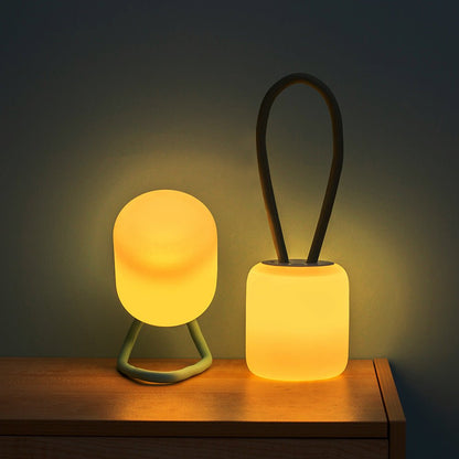 Portable LED night light featuring a soft ambient glow, available in green and blue, designed for battery-powered convenience and compact use. 4
