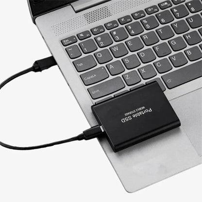 Portable SSD with USB-C connection featuring durable aluminum housing, ideal for fast storage solutions for work and travel. 7