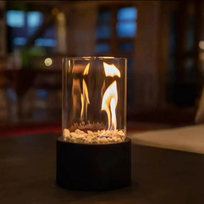 Portable tabletop fireplace featuring a sleek design with a bioethanol burner and glass panels, perfect for modern indoor settings. 5