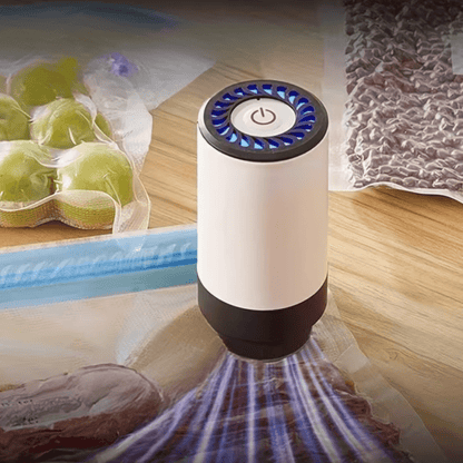 Portable vacuum sealer machine with dehumidifier function, designed for efficient moisture control and compact food storage, featuring easy-to-use controls and a sleek design 0