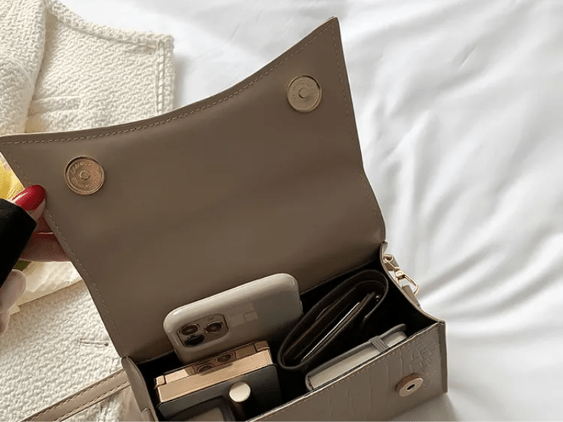 PU leather handbag featuring a stylish top handle and a detachable crossbody strap, perfect for everyday use with a classic design in a versatile color. 6