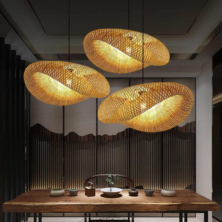 Handmade rattan pendant light featuring a wavy bamboo shade, perfect for adding a natural touch to kitchen and dining spaces. 0