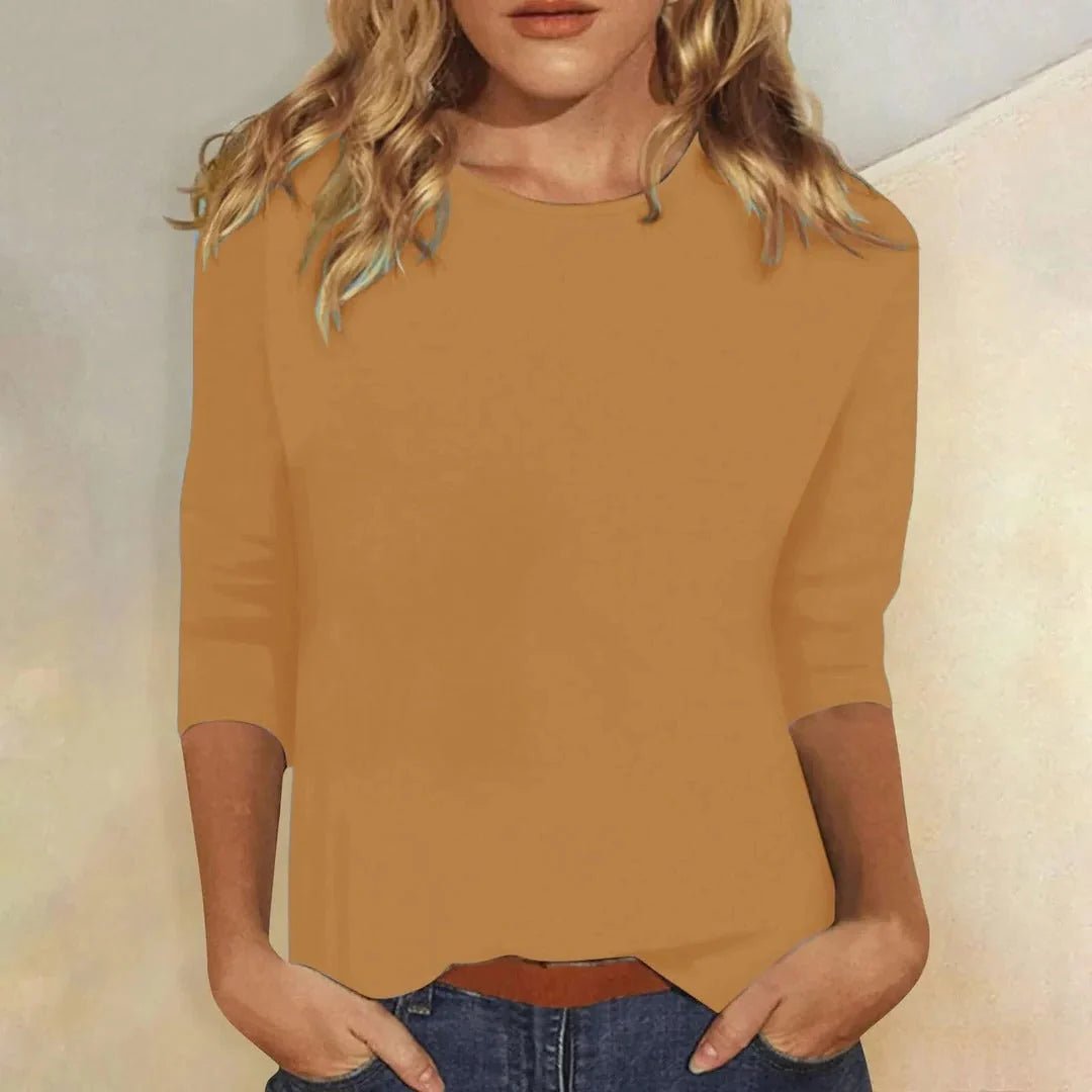 Relaxed 3/4 sleeve top with crew neck, perfect for versatile everyday wear, featuring a comfortable fit and stylish design. 8
