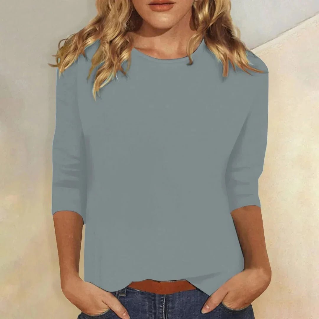 Relaxed 3/4 sleeve top with crew neck, perfect for versatile everyday wear, featuring a comfortable fit and stylish design. 3
