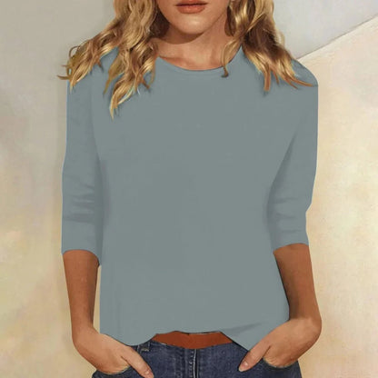 Relaxed 3/4 sleeve top with crew neck, perfect for versatile everyday wear, featuring a comfortable fit and stylish design. 3