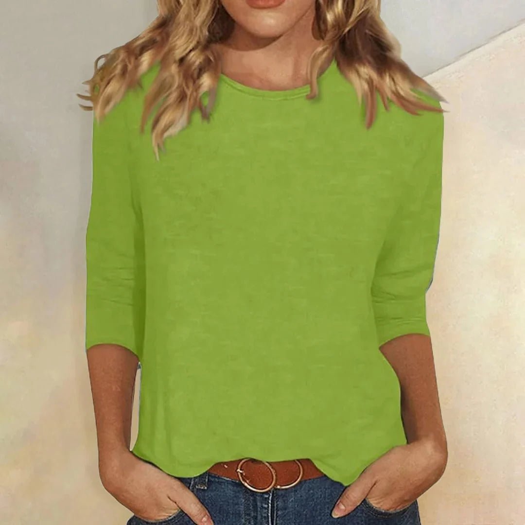 Relaxed 3/4 sleeve top with crew neck, perfect for versatile everyday wear, featuring a comfortable fit and stylish design. 5