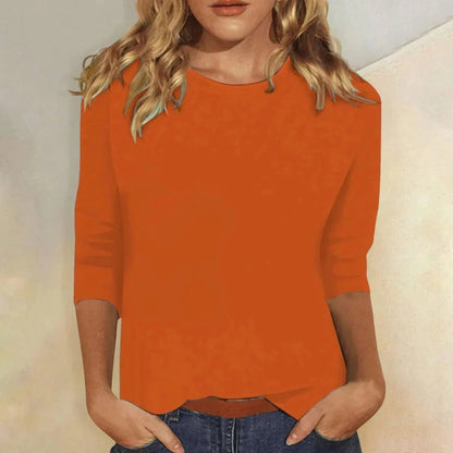 Relaxed 3/4 sleeve top with crew neck, perfect for versatile everyday wear, featuring a comfortable fit and stylish design. 7