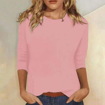 Relaxed 3/4 sleeve top with crew neck, perfect for versatile everyday wear, featuring a comfortable fit and stylish design. 1