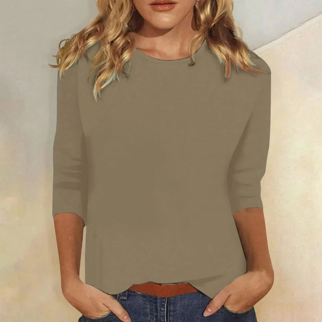 Relaxed 3/4 sleeve top with crew neck, perfect for versatile everyday wear, featuring a comfortable fit and stylish design. 6