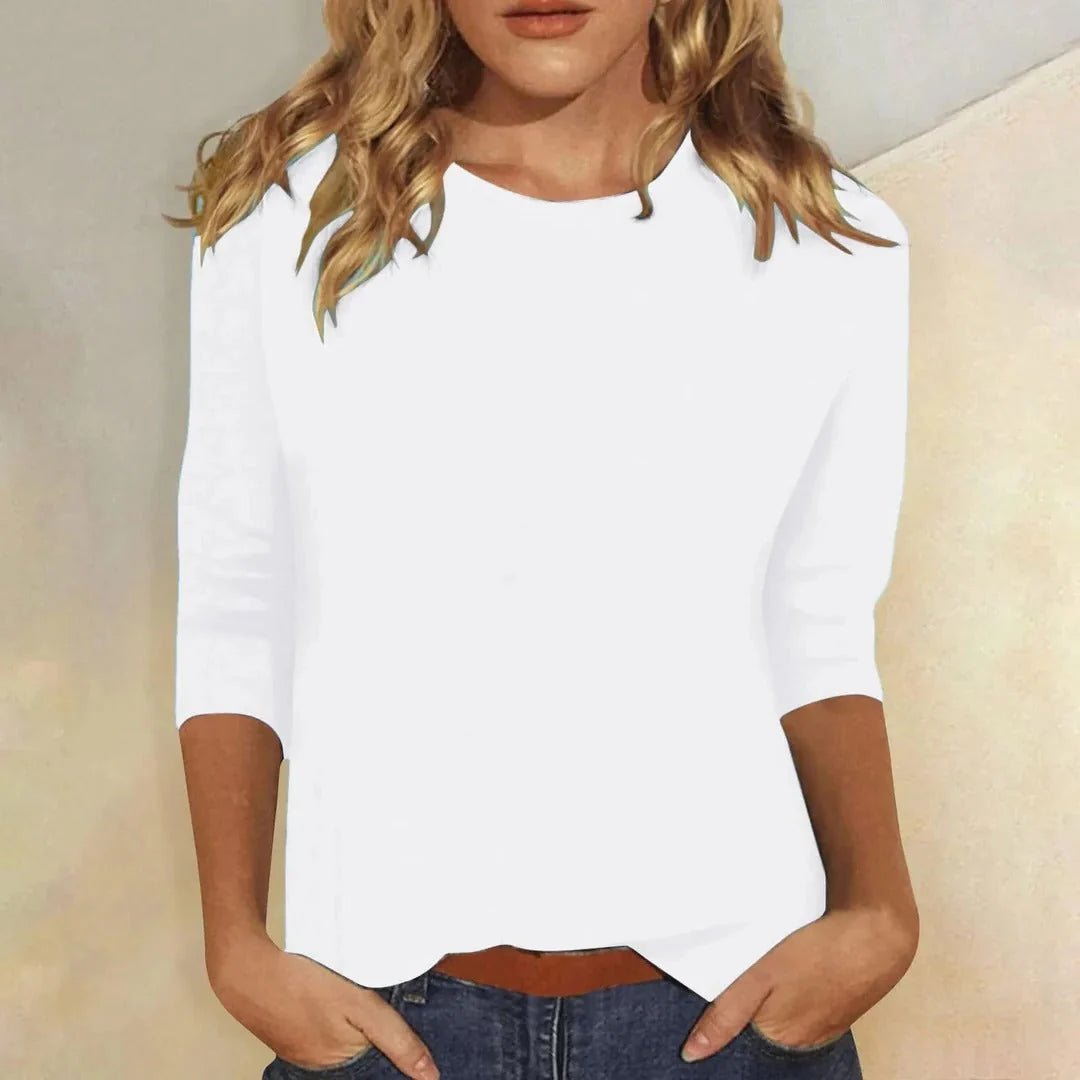Relaxed 3/4 sleeve top with crew neck, perfect for versatile everyday wear, featuring a comfortable fit and stylish design. 2