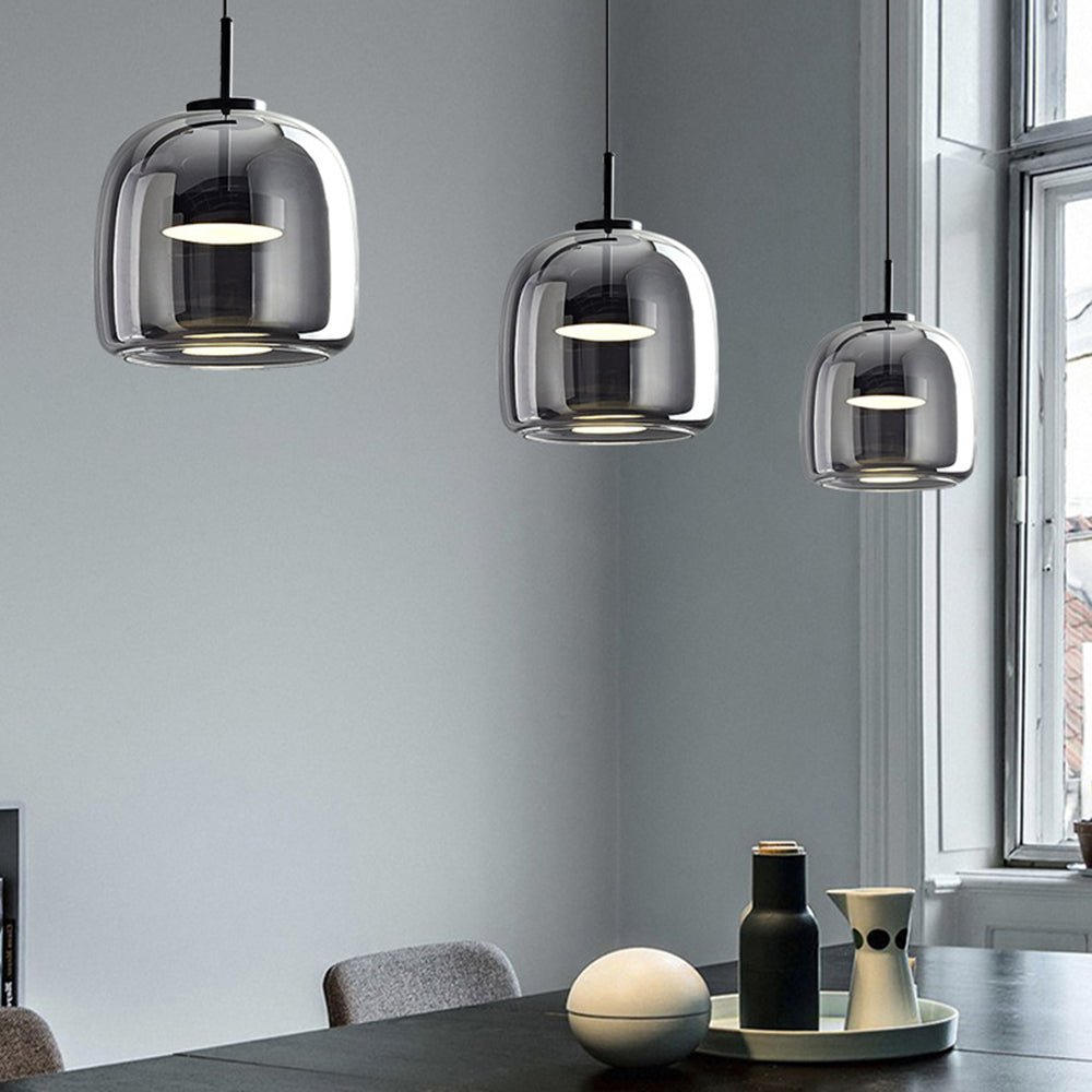 Retro pendant lamp featuring an amber glass shade and a black metal fixture, perfect vintage lighting for kitchen and dining spaces. 2