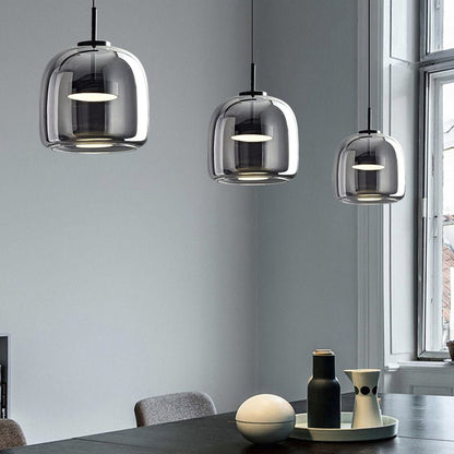 Retro pendant lamp featuring an amber glass shade and a black metal fixture, perfect vintage lighting for kitchen and dining spaces. 2