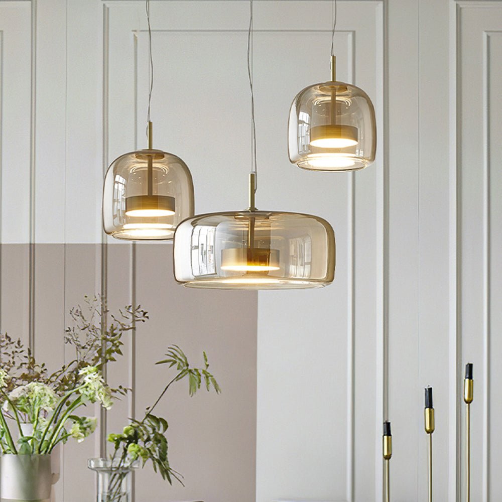 Retro pendant lamp featuring an amber glass shade and a black metal fixture, perfect vintage lighting for kitchen and dining spaces. 1