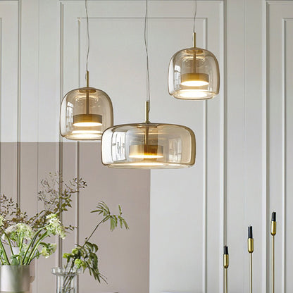Retro pendant lamp featuring an amber glass shade and a black metal fixture, perfect vintage lighting for kitchen and dining spaces. 1