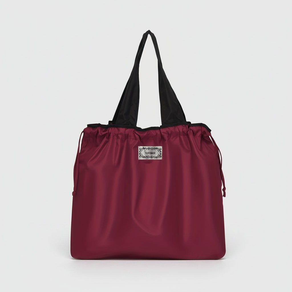 Reusable tote bag with a rectangle design and wristlet strap, perfect for shopping and everyday use, featuring durable materials and stylish aesthetics. 2