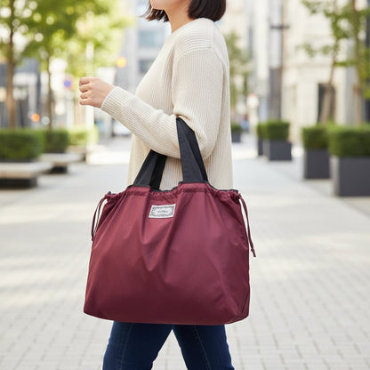 Reusable tote bag with a rectangle design and wristlet strap, perfect for shopping and everyday use, featuring durable materials and stylish aesthetics. 9