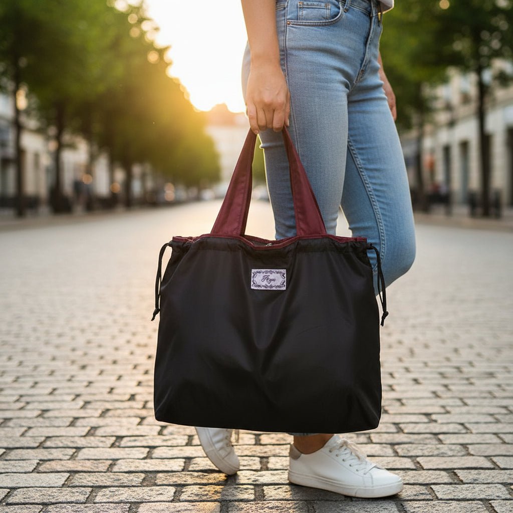 Reusable tote bag with a rectangle design and wristlet strap, perfect for shopping and everyday use, featuring durable materials and stylish aesthetics. 16