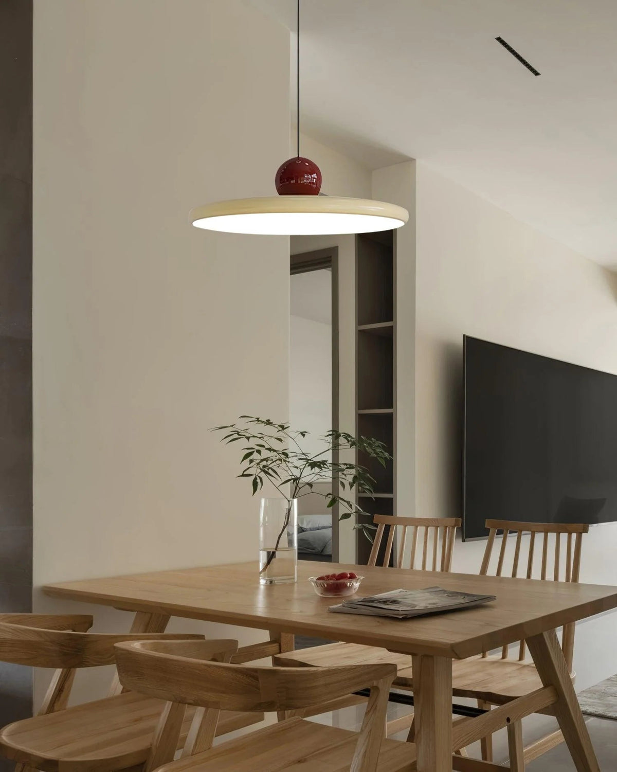 Round pendant light featuring an adjustable cable and integrated LED, showcasing a sleek modern metal and acrylic design, perfect for illuminating kitchen islands. 8