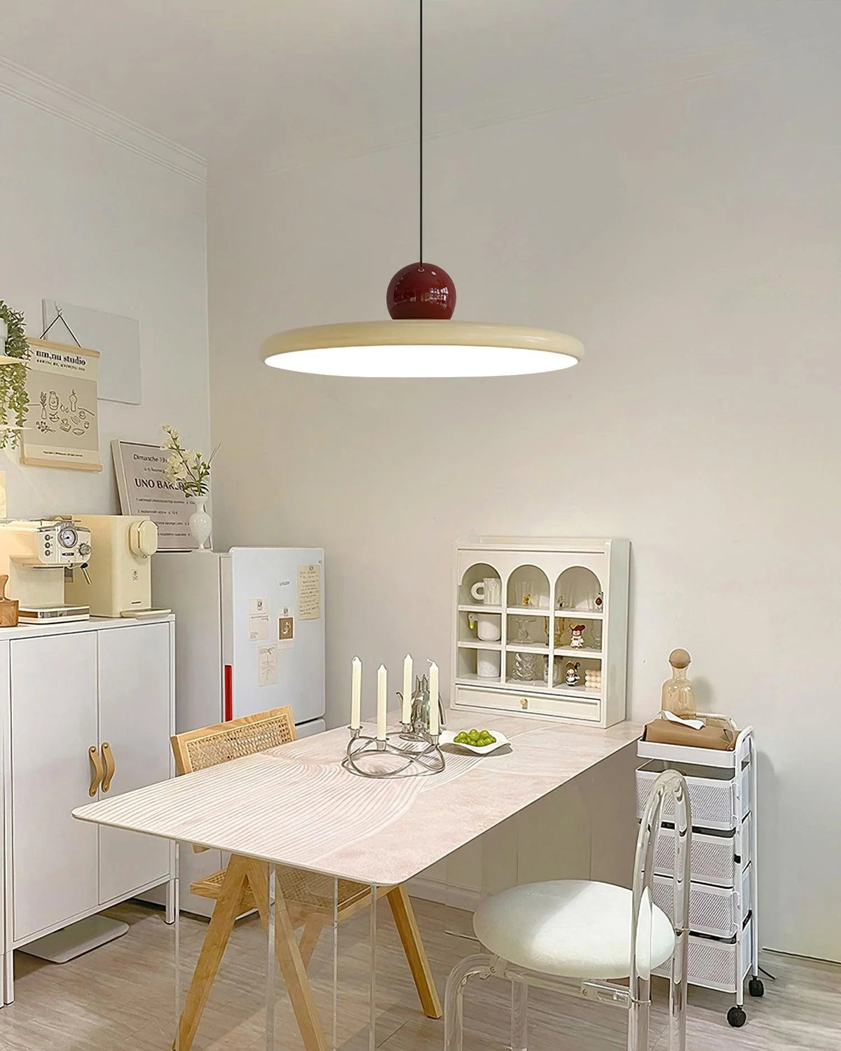 Round pendant light featuring an adjustable cable and integrated LED, showcasing a sleek modern metal and acrylic design, perfect for illuminating kitchen islands. 6