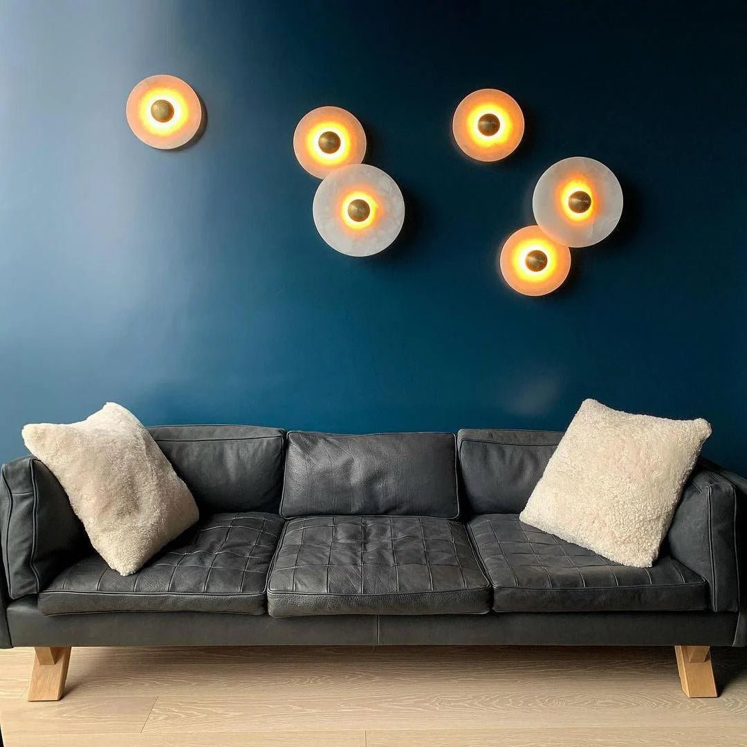 Round wall light featuring a natural alabaster face, available in elegant gold or bronze finish, designed for modern illumination and aesthetic appeal. 3
