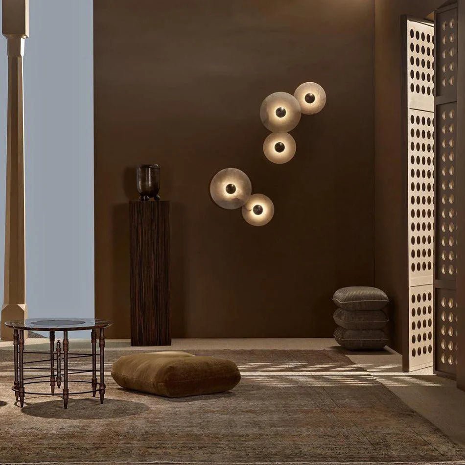 Round wall light featuring a natural alabaster face, available in elegant gold or bronze finish, designed for modern illumination and aesthetic appeal. 4
