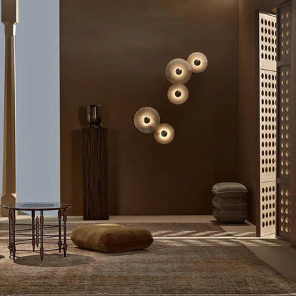 Round wall light featuring a natural alabaster face, available in elegant gold or bronze finish, designed for modern illumination and aesthetic appeal. 4