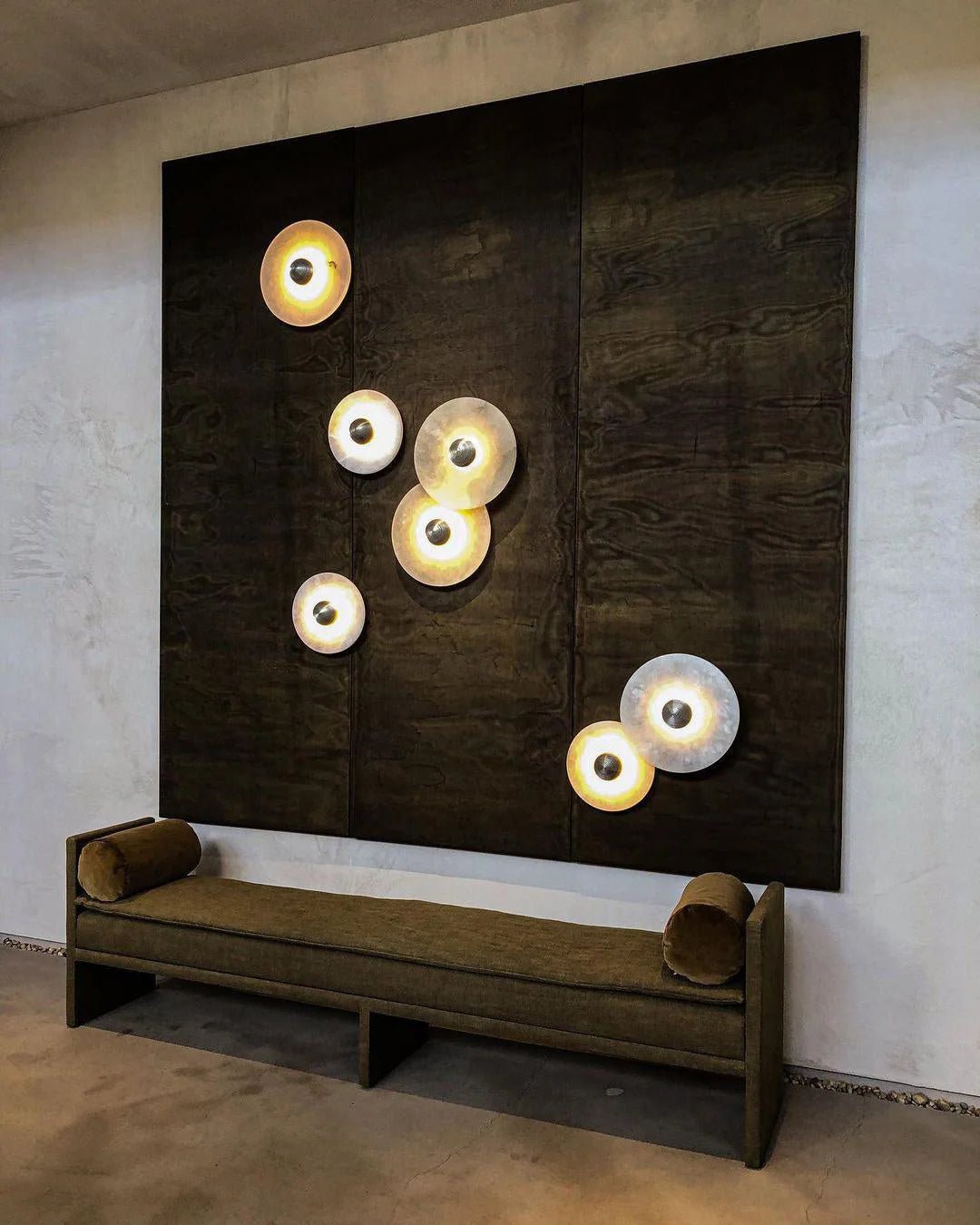 Round wall light featuring a natural alabaster face, available in elegant gold or bronze finish, designed for modern illumination and aesthetic appeal. 7