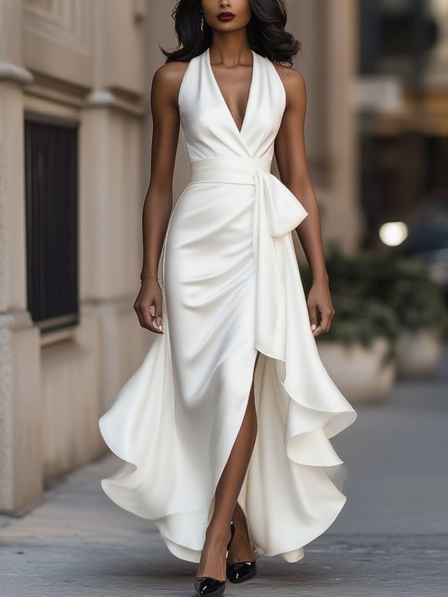 Satin evening gown in midnight navy featuring a high-low hem and ruffle details, perfect for weddings and formal events. 8