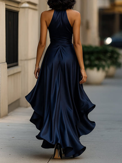 Satin evening gown in midnight navy featuring a high-low hem and ruffle details, perfect for weddings and formal events. 1
